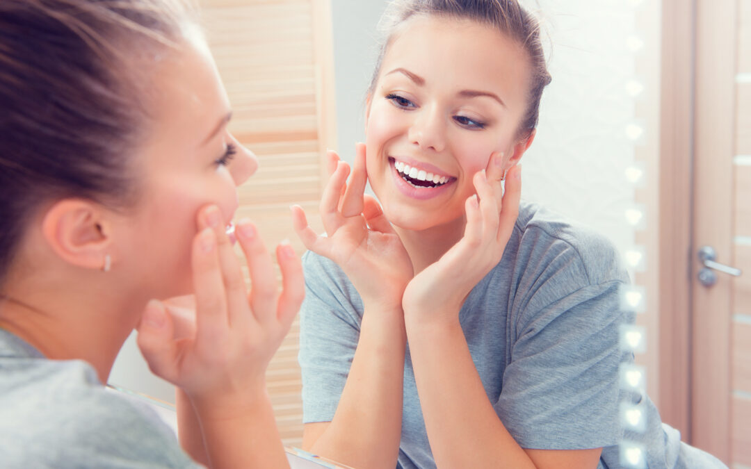 Beauty skin care. Young beautiful teenage girl touching her face ...